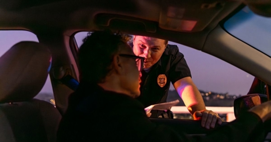 DWI checkpoint police talking to driver